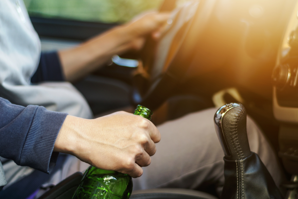 Drinking And Driving Man Drinking Alcohol And Using Mobile Phone While